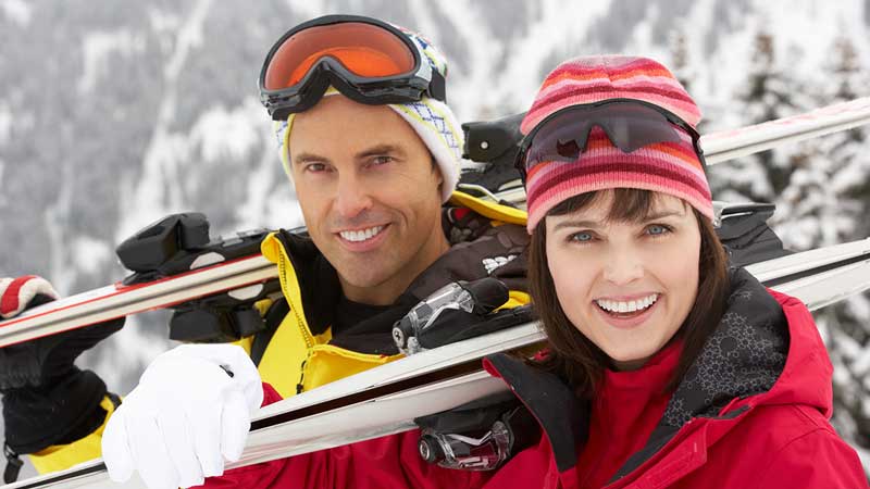 Skiers smiling since they own waterfront land near great skiing